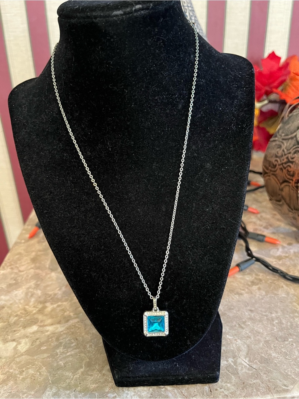 Vintage Square blue gemstone pendant necklace with a halo setting and a fine lin